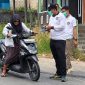 Foto: Lapas Narkotika Kelas IIA Samarinda bersama PIPAS saat membagikan masker ke warga sekitar. (Dok. Lapas Narkotika Smd Kelas IIA)